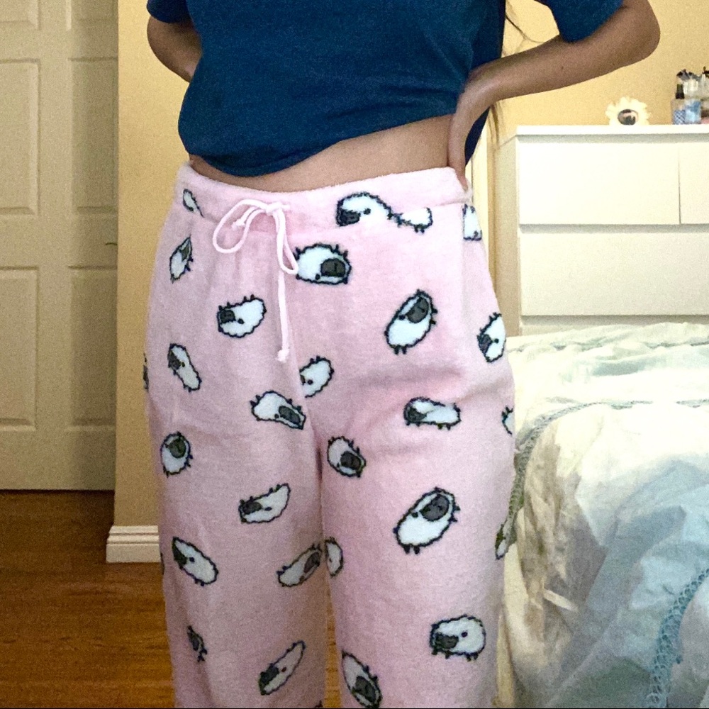 Fuzzy pink pajama pants with sheep